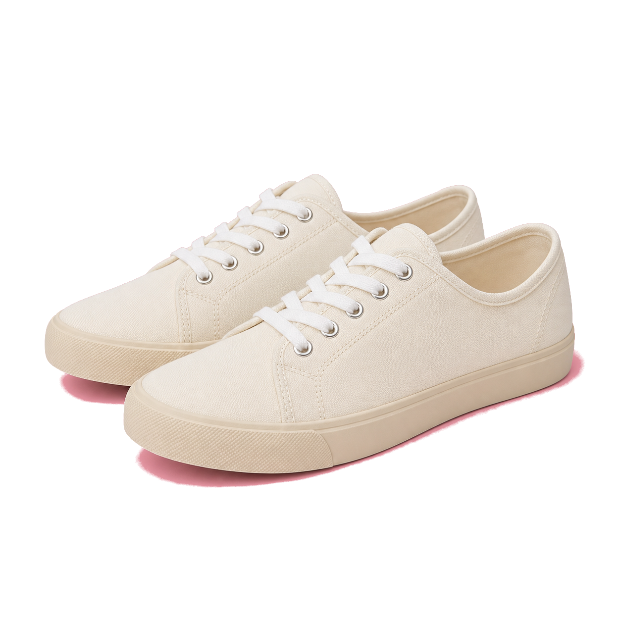 Cream sneakers photographed on a pink backdrop after color removal
