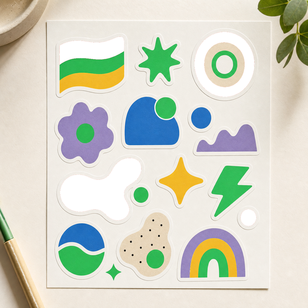Sticker sheet with colorful geometric shapes on a light background after color removal